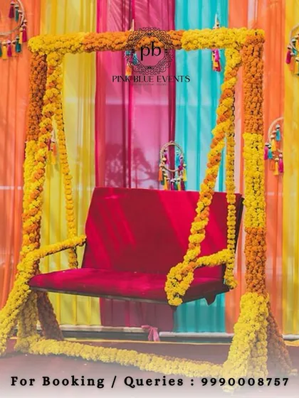 A beautiful jhoola (swing) decorated entirely with marigolds makes for a perfect photo spot at a Haldi or Mehendi function. We set this against a backdrop of colorful drapes to make the colors pop.