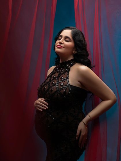 Glamour and drama with this stunning black sequined gown. The combination of red and blue lighting adds an artistic, high-fashion feel to the portrait.