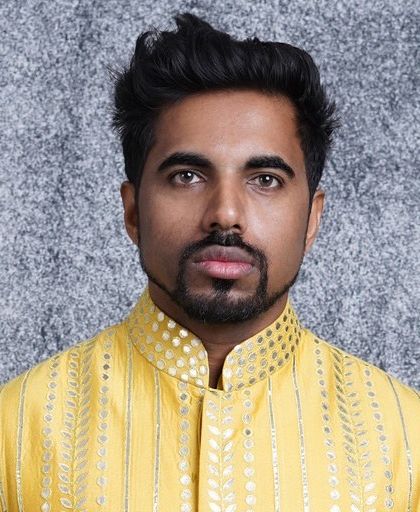 A close-up portrait in our canary yellow kurta. This view highlights the detailed gota embroidery along the placket and collar, perfect for festive occasions.