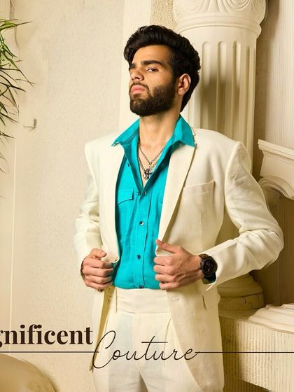 Magnificent Couture. This off-white three-piece suit, paired with a vibrant shirt, is designed for celebration. The soft, breathable fabric keeps you comfortable from the boardroom to the dance floor.