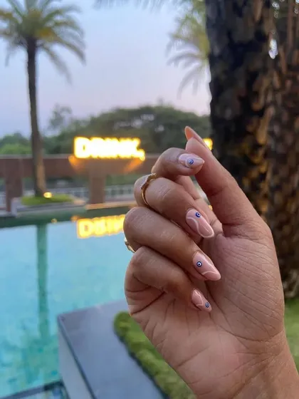 Another lifestyle shot of the evil eye nails, showing how great they look for a vacation or a day out.