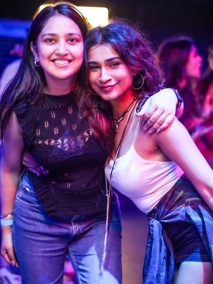 Friends enjoying the music at Toca Brigade during a Thursday ladies' night.