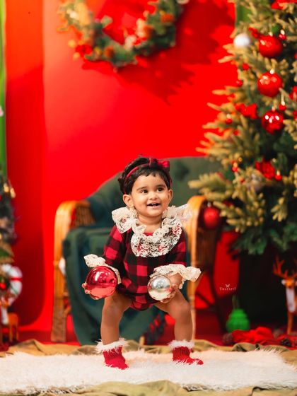 A joyful, energetic pose from a Christmas mini session, full of holiday spirit.
