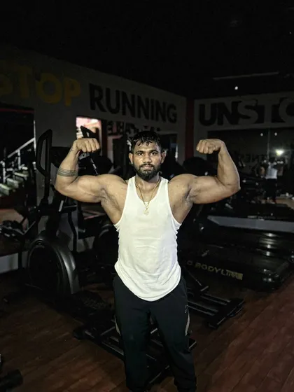 A classic front double bicep flex. This pose is a staple in bodybuilding for a reason.
