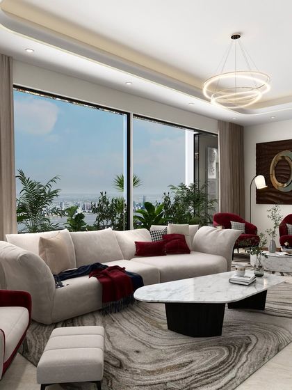 A wider view of the living space, showing how the neutral sofa and swirling rug pattern balance the bold accent chairs. The large window frames a beautiful view, connecting the interior with nature.