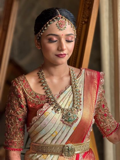 This shot highlights the soft, blended eye makeup and the flawless finish of the skin. It's a perfect example of a classic yet modern bridal look.