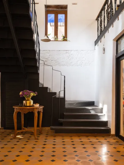 This is the staircase in my own studio, a building we brought back to life after it lay silent for 40 years. We preserved the home's history, keeping the original mitti and brick walls and pairing them with bold, patterned floor tiles. It’s a daily reminder that every space has a story waiting to be told.