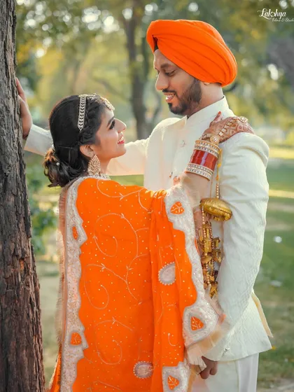 An intimate and romantic pre-wedding portrait. The way the bride holds onto the groom while they gaze at each other creates a timeless and heartfelt image.