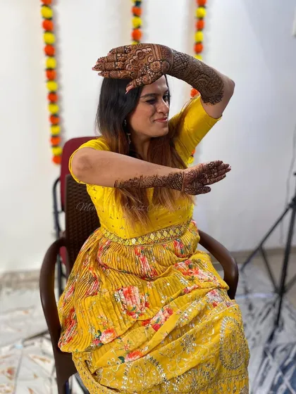 Another pose from the happy bride with her mandala mehendi.