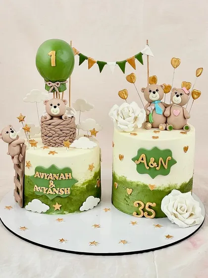 A bear-y cute celebration for Avyanah & Anyansh's first birthday and a 35th anniversary. These matching cakes feature adorable teddy bears and a lovely green and gold theme.