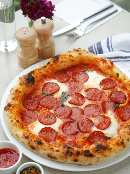 We take our Napoletana pizzas seriously. The secret lies in our special Swiss flour mix for a fluffy crust, a rich sauce from Italian San Marzano tomatoes, and locally sourced fresh mozzarella, all baked to perfection.