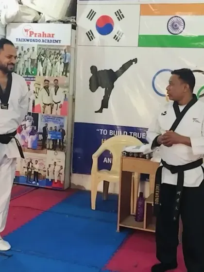 A moment of discussion and evaluation between examiners during a black belt test. We ensure our tests are conducted with the highest standards.