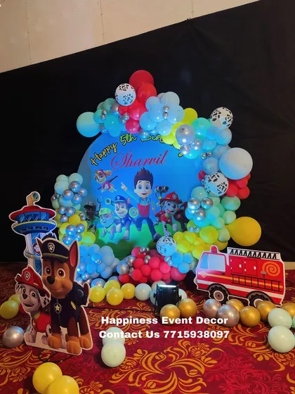 Another perspective of the full Paw Patrol stage, showing the arrangement of balloons, backdrop, and character props.