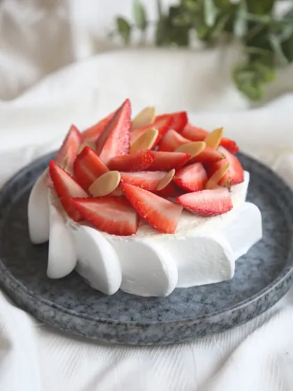 Another angle of our Strawberry Feta Cheesecake, showing the creamy texture and generous strawberry topping.
