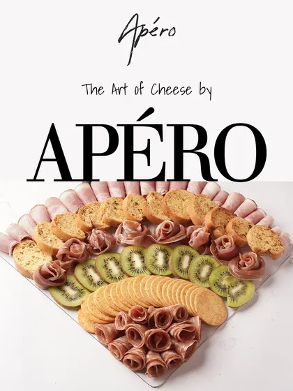 The Art of Cheese by Apero. This image showcases a beautifully arranged platter with charcuterie, crackers, and fresh kiwi, highlighting the elegance of our offerings.