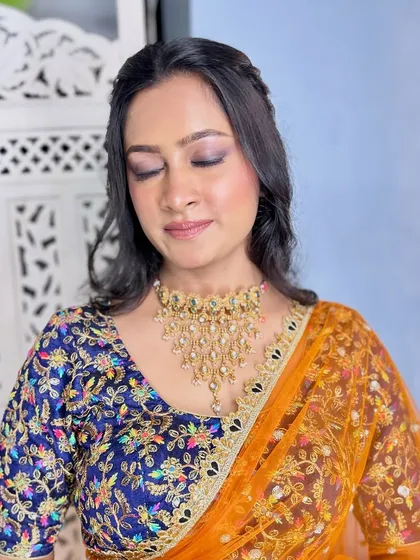 A serene shot with eyes closed, highlighting the beautiful eyeshadow work. This look is perfect for an editorial or fashion shoot.