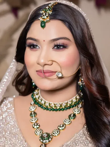 An elegant and soft bridal look with emerald green jewelry. My student learned to balance the makeup with the accessories, creating a cohesive and beautiful final result.