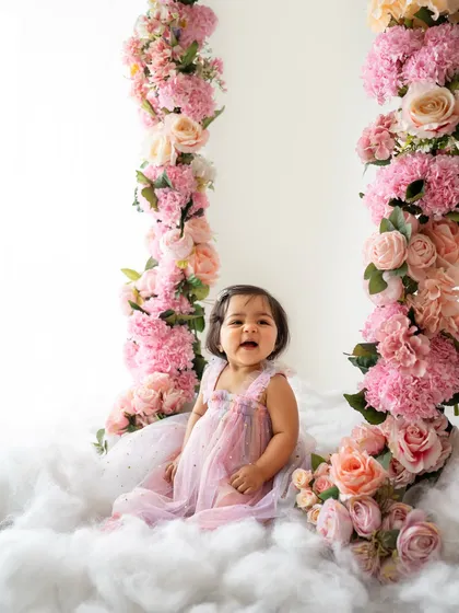 A big, happy laugh from the floral swing. These setups are perfect for sitter sessions and create such magical portraits.