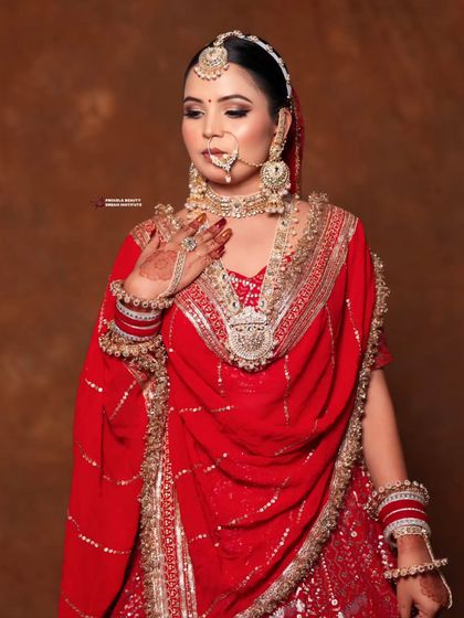 This angle highlights the intricate details of the bridal jewelry and the clean lines of the hairstyle. It's a look of pure elegance and tradition.