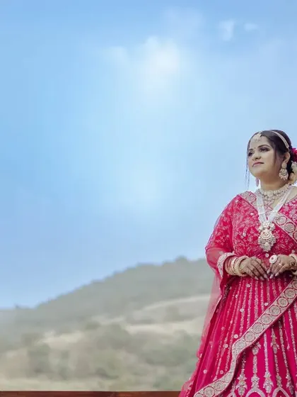 A stunning bridal portrait against a beautiful blue sky. The low angle makes the bride look majestic and powerful.