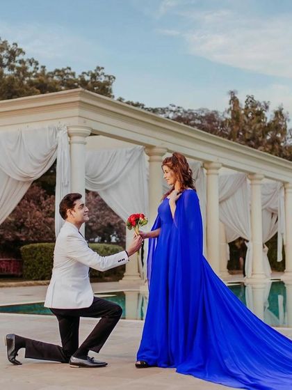 A fairytale proposal moment during the anniversary shoot. Her makeup is flawless and radiant, making this a truly magical picture.