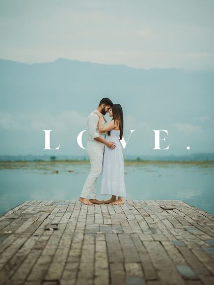 A powerful and simple composition from the Dal Lake shoot, letting the couple's embrace and the word "LOVE" tell the whole story.