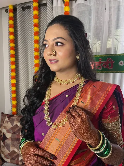 A close-up of the engagement bride's soft, romantic makeup and hairstyle.
