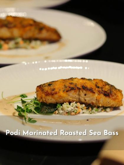 A closer look at the Podi Marinated Roasted Sea Bass from my 'Sounds of India' menu. The fish is perfectly cooked and sits on a bed of fresh greens, ready for the sauce.