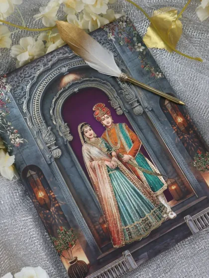 The front of the grey invitation, featuring a beautifully illustrated royal couple framed within an ornate, silver-foiled archway.