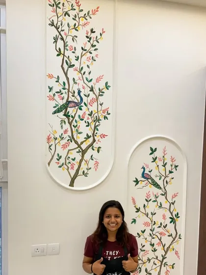 Standing proud with one of my favorite wall mural projects. This piece, featuring peacocks perched on delicate branches, was designed to bring a sense of serene nature into a double-height living space. I love creating large-scale art that completely transforms a room.
