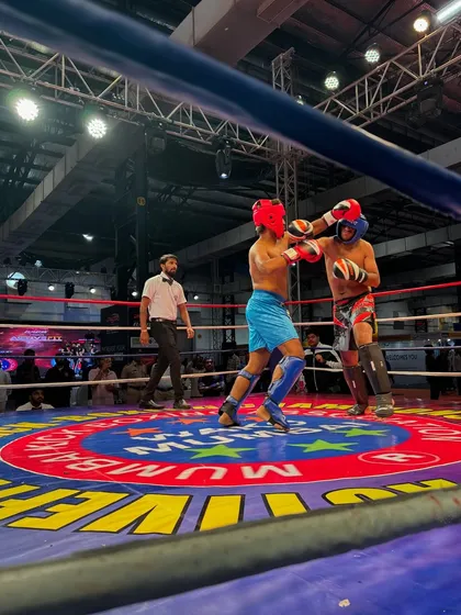 In the heat of battle. Two fighters trading blows, showing the grit and conditioning required to compete at this level.