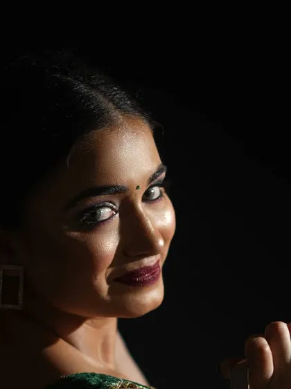 A powerful portfolio headshot is all about the eyes. I used a high-contrast lighting setup to create deep shadows and draw all the attention to the model's direct, confident gaze. This minimalist approach shows incredible range and emotion.