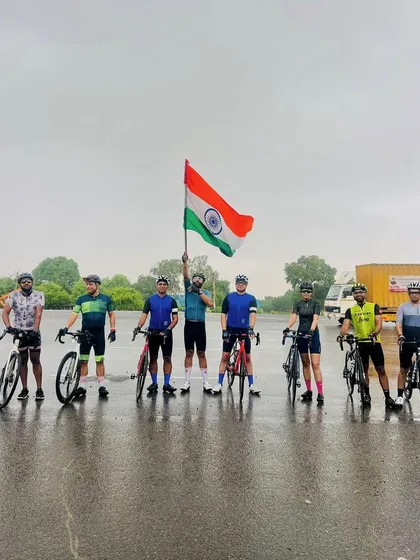 The group poses on a wet road after an Independence Day ride in the rain. Nothing stops us!