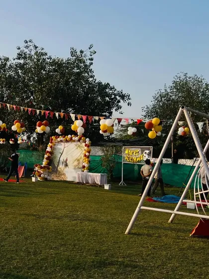 The play area, complete with swings and a slide, is a popular spot during any family event or birthday party.