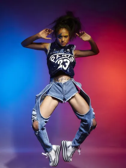 A high-energy jump shot, frozen in time with precision lighting. Capturing dynamic action shots like this is perfect for sportswear or streetwear brands looking to convey movement and an active lifestyle.