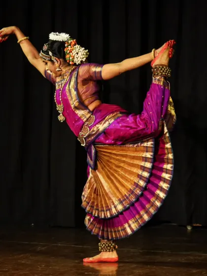 A moment of dynamic energy from my solo production, "Moham". This pose captures the physical discipline and grace that Bharatanatyam demands, showcasing the culmination of years of training in a single, powerful movement on stage.
