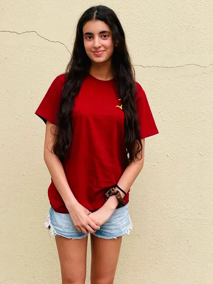 One of my talented swimmers, Veera Prathambir, sporting our new team shirt.