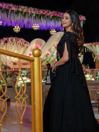 Another angle of the elegant reception hairstyle, perfect for showing off statement earrings.