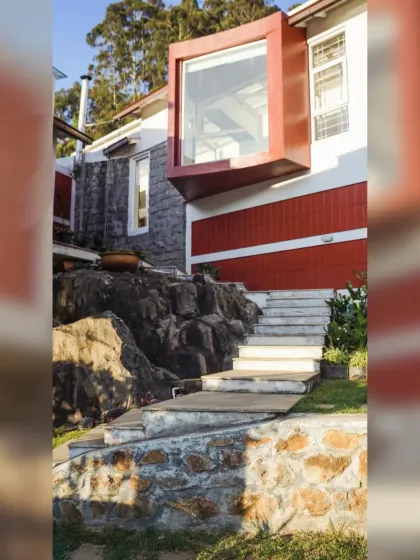 At the Raghunath Farmhouse, we encountered a large rock formation right in the middle of the site. Instead of removing it, we chose to build around it, letting the natural landscape guide the design. This decision shaped the entire split-level structure, resulting in a home that is truly integrated with its environment.