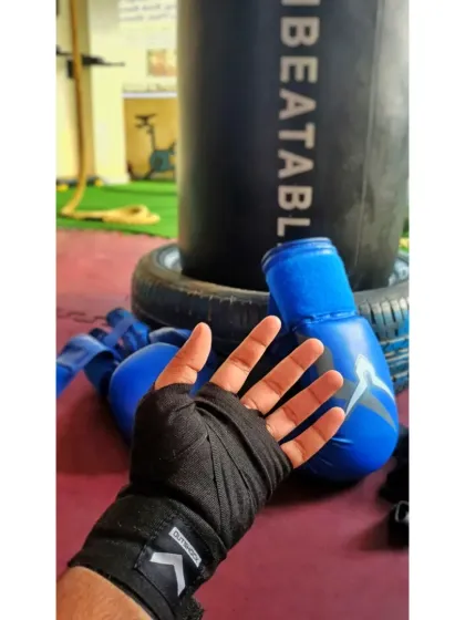 Wrapping my hands is a ritual. It prepares these tools for battle, just as I prepare my legal arguments to dismantle the opposition's case.