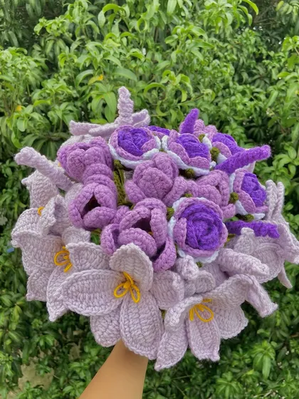 A custom all-purple bouquet featuring a mix of lilies, tulips, and roses.