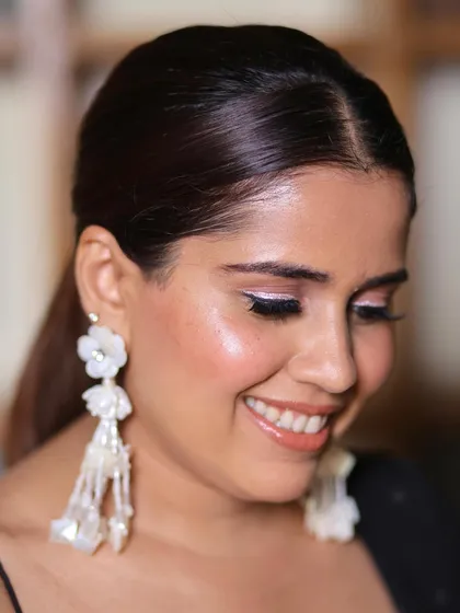 A touch of makeup magic for this bridesmaid. I gave her glowing skin with a hint of white shimmer on the inner corner of her eyes to make them sparkle.