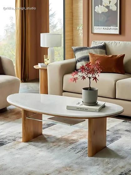 Details matter, and this coffee table design shows how I mix materials to create a functional centerpiece. The elegant oval marble top provides a touch of luxury, while the solid wood legs add natural warmth. It’s a piece that is both beautiful to look at and practical for everyday life.