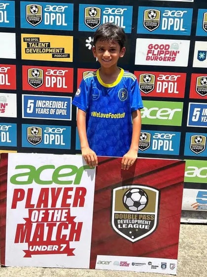 This U7 player's smile says it all. We are proud to see our youngest ballers shine.