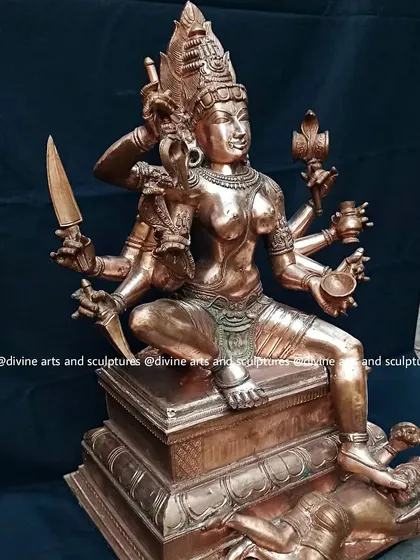 A bronze statue of Mysore Chamundeshwari, a form of Durga. The sculpture depicts her slaying the demon Mahishasura, a powerful symbol of the victory of good over evil.
