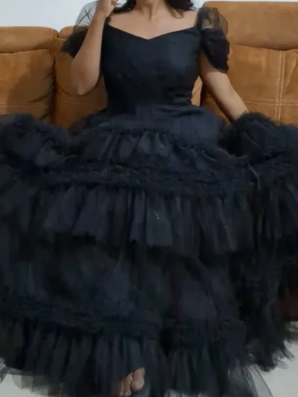 Why have one look when you can have two? This black Senorita gown is one of my convertible designs, easily changing from a full-length, three-layer gown to a chic frock for a different style.