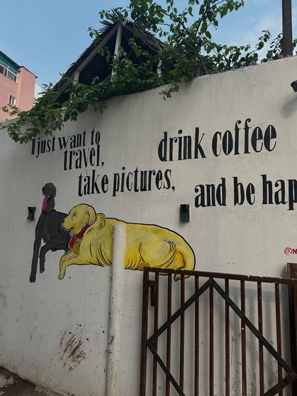 "I just want to travel, drink coffee, take pictures, and be happy." A mural from Rishikesh that perfectly captures my life philosophy.