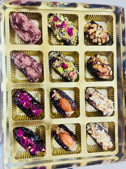 My gourmet stuffed dates are a customer favorite. This beautiful box shows an assortment of flavors, each one a bite of pure indulgence made with natural ingredients like nuts, peanut butter, and vegan dark chocolate.