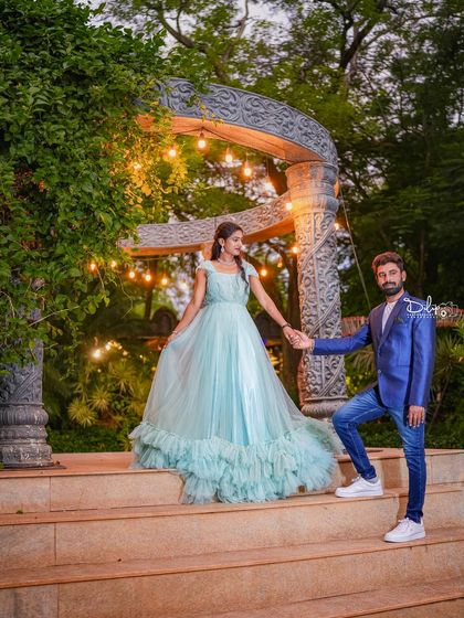 A romantic pose on the steps of our stone gazebo, with the evening lights creating a magical atmosphere.