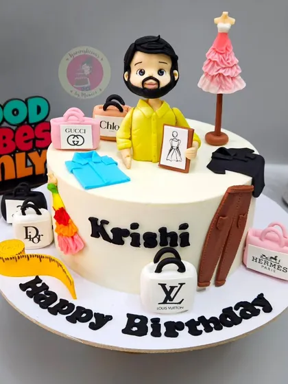 A stylish cake for a fashion stylist, decorated with miniature fondant versions of designer bags, clothes, and a mannequin. Even with last-minute orders, I love the challenge of creating these detailed, personalized themes.